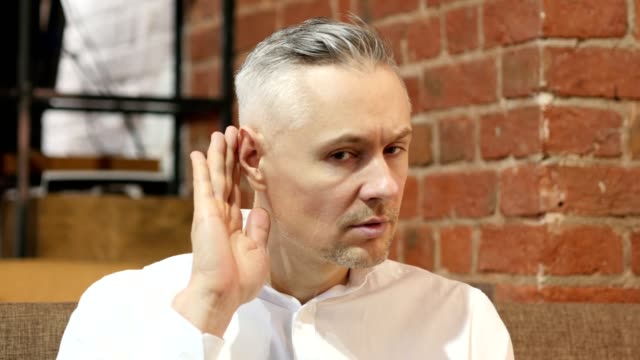 Middle-Age-Man-Listening-Gesture