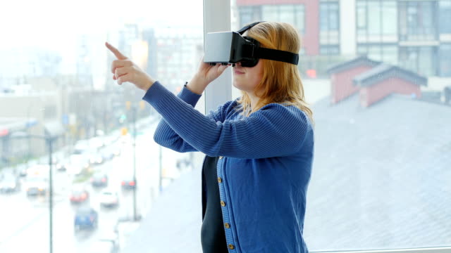 Woman-using-virtual-reality-headset