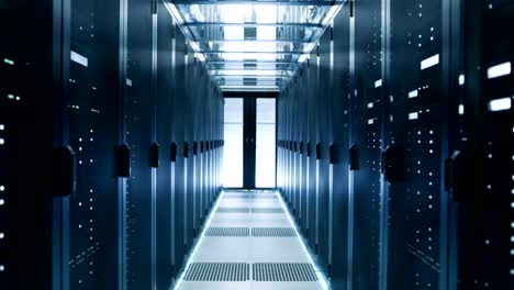 Elevating-Camera-Shot-of-Corridor-in-Working-Data-Center-Full-of-Rack-Servers-and-Supercomputers.