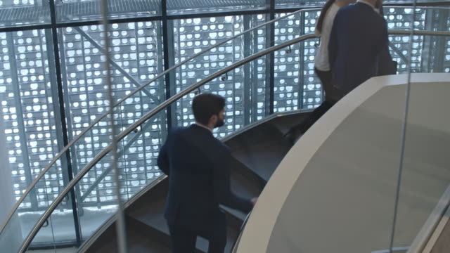 Businesspeople-on-Spiral-Staircase