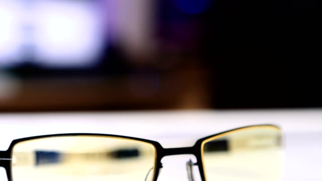 Closeup-Of-Computer-Glasses-Down-Tilt-Movement