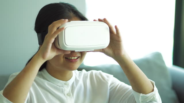 Asian-woman-wearing-virtual-reality-headset