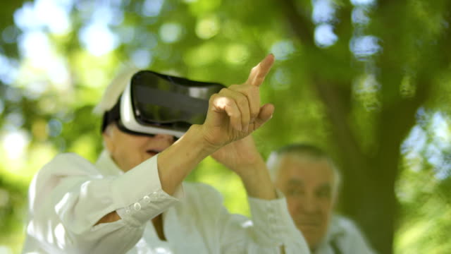 Mature-woman-using-virtual-reality-glasses