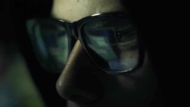 Hacker-with-glasses-connecting-online-and-stealing-data