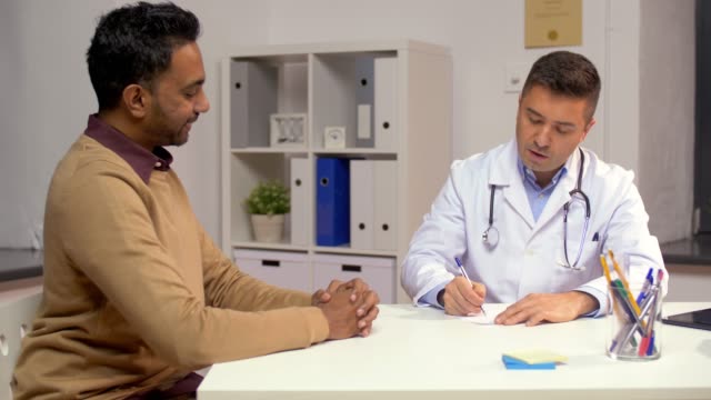 doctor-and-male-patient-meeting-at-clinic
