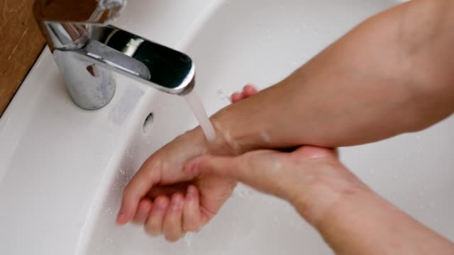 Coronavirus-pandemic-prevention-wash-hands-with-soap-warm-with-water.