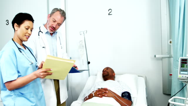 Doctor-and-nurse-interacting-with-patient