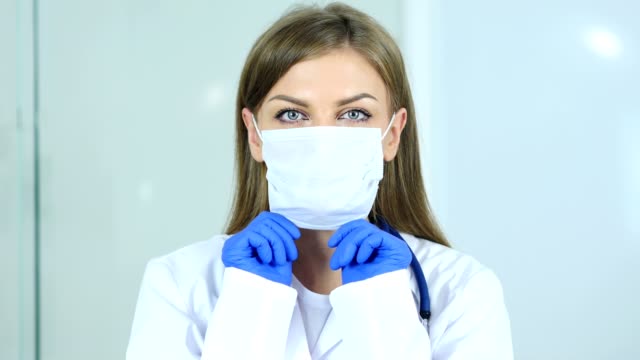 Close-Up-of-Doctor-Wearing-Mask-in-Clinic