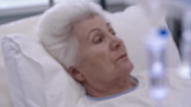 Elderly-Patient-Behind-IV-Chamber