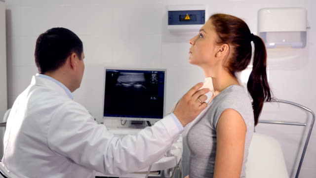 Close-up-of-the-doctor--making-the-ultrasound-examination-of-the-larynx