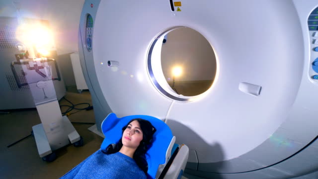 Woman-on-a-magnetic-resonance-imaging-MRI-scan-in-a-modern-hospital.