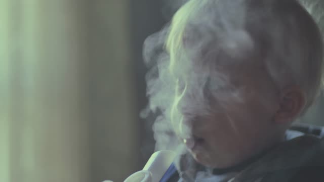baby-boy-making-inhaler-treatment-with-aerosol