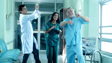 Doctor-and-patient-dance-together-at-hospital.