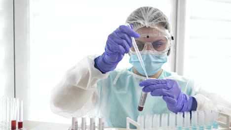 Blood-test-for-covid-19-in-the-laboratory.-Female-laboratory-assistant-working-with-the-dispenser