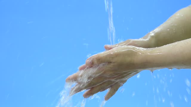 Slow-motion-video-of-woman-washing-hands-under-flowing-water