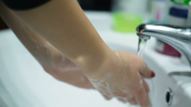Woman-washing-Hands-with-sanitiser-soap-in-covid-19-pandemic-disease,health-care