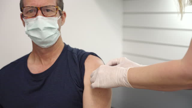 a-male-patient-receives-a-vaccination
