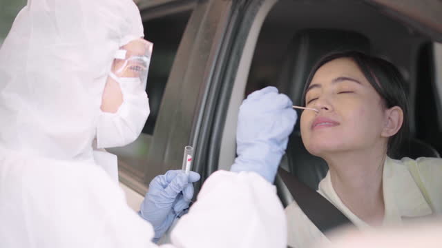 Doctor-officer-test-coronavirus-or-Covid-19-at-the-people-drive-Thru