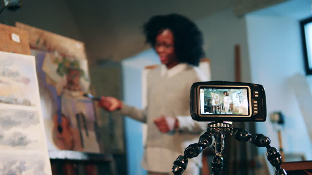 Art-lesson-of-an-african-lady-is-being-filmed-on-a-camera