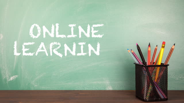 ONLINE-LEARNING.-School-classroom-with-green-chalk-board