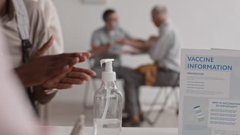 Using-Hand-Sanitizer-in-Vaccination-Center