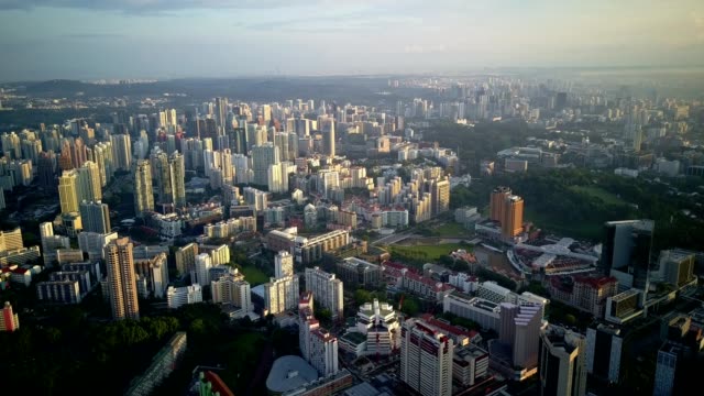 Beautiful-morning-drone-footage-of-Singapore-urban-skyline-and-its-residential-buildings.