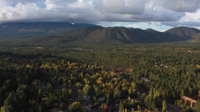 Aerial-drone-view-of-a-small-hilly-town,-Flagstaff-mountain,-Arizona,-USA