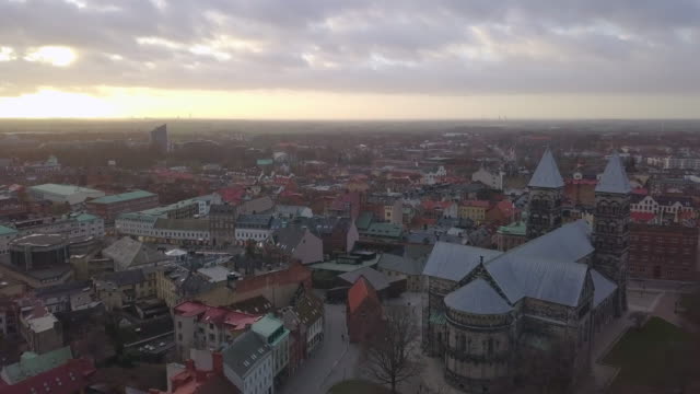 Aerial-view-of-Lund-Cathedral-and-Lund-city-skyline-at-sunset,-Sweden