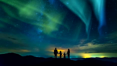 The-family-standing-on-the-rock-on-the-northern-light-background.-time-lapse