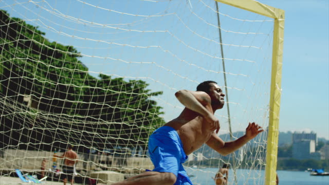 Brazilian-man-attempts-to-block-a-soccer-goal.