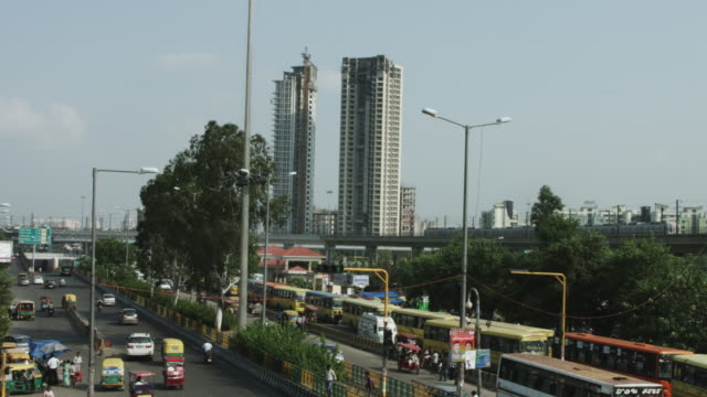 Time-lapse-shot-of-traffic-moving-on-city-street,-Delhi,-India