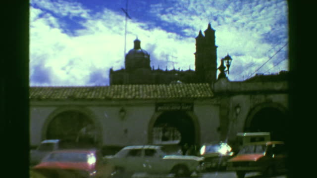 1978:-Old-city-center-diving-taxi-windshield-view-archway-stone-buildings.