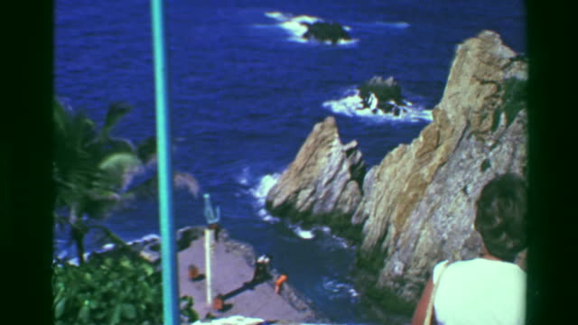 1978:-Famous-cliff-diving-rocks-of-La-Quebrada-monument-statue-zoom.