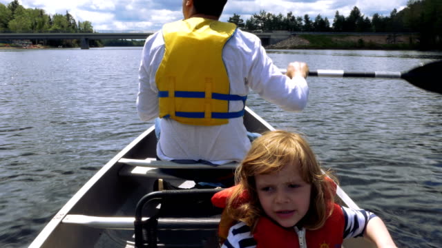 Man-Rowing-Around-Cottage-Country-Ontario-With-Daughter-on-Board