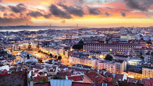 Lisbon-historic-city-at-sunset,-Portugal,-Time-lapse