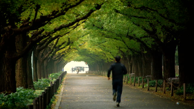 Man-running-for-exercise-in-a-park-in-Tokyo.