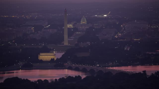 Aerial-view-of-the-Lincoln-Memorial,-Washington-Monument-and-Capitol-Building-at-sunrise.