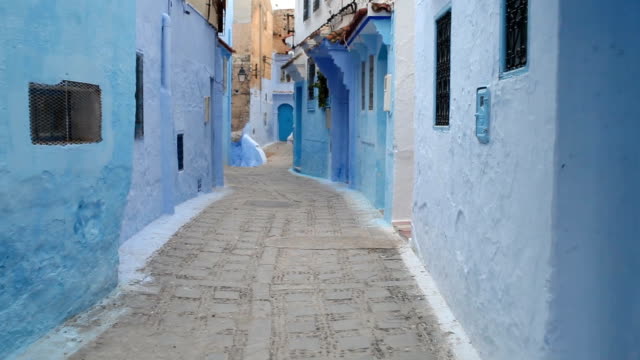 POV-walking-in-blue-town-Chefchaouen-Chaouen-/-Morocco,-first-point-of-view