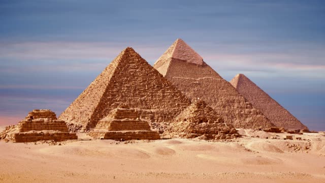 Timelapse-Of-The-Great-Pyramids-In-Giza-Valley,-Cairo,-Egypt.-Sunset-over-the-pyramids.