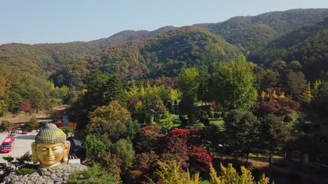 Aerial-view-Autumn-of-Statue-of-Buddha-in-Wawoo-Temple,-Yong-in.-Seoul,-Korea