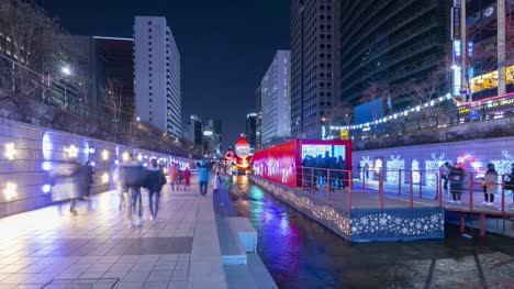 Cheonggyecheon-Stream,People-walking-on-Beautiful-Christmas-Light-at-night-in-Seoul,-South-Korea
