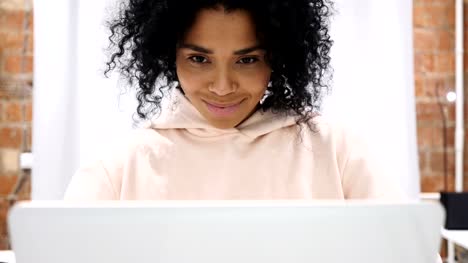 Portrait-of-Smiling-Positive-Afro-American-Woman-Working-on-Laptop
