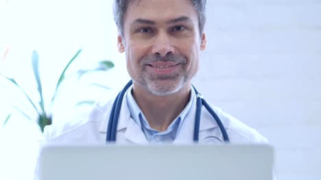 Doctor-Smiling-While-Looking-at-Camera-in-Clinic