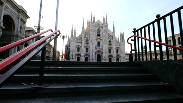 A-man-walk-the-staircase-at-Duomo-train-station-towards-Duomo-di-Milano,-the-Cathedral-Church-of-Milan,-Lombardy,-Northern-Italy.