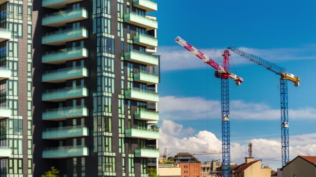 Italy-sunny-day-milan-city-modern-block-construction-cranes-panorama-4k-timelapse