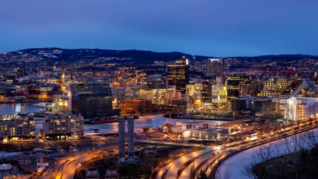 Oslo-aerial-view-city-skyline-day-to-night-sunset-timelapse-at-business-district-and-Bercode-Project,-Oslo-Norway-4K-Time-Lapse