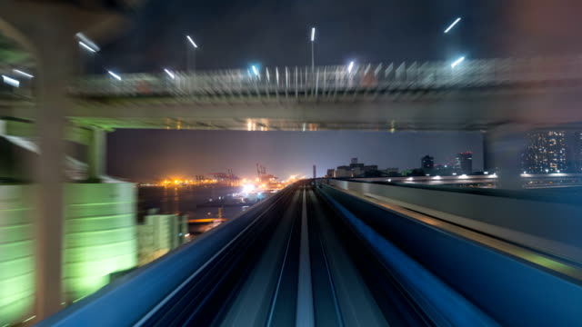 Time-lapse-of-automatic-train-moving-to-tunnel-in-Tokyo,-Japan.-4K