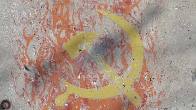 pan-of-a-soviet-hammer-and-sickle-painted-on-a-section-of-the-berlin-wall