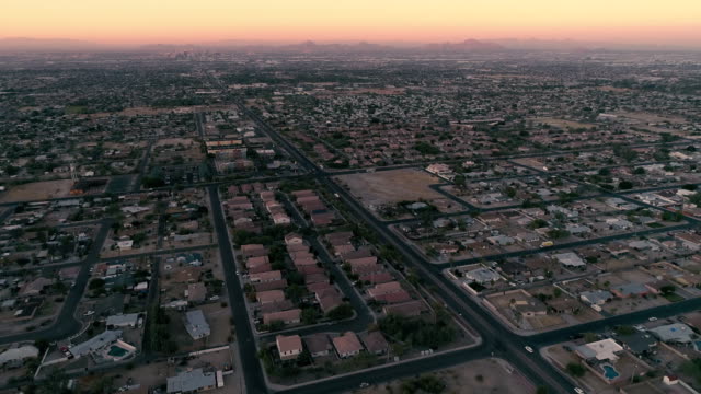 Phoenix-Neighborhoods-Sunset-Aerial-with-Camelback-Mountain