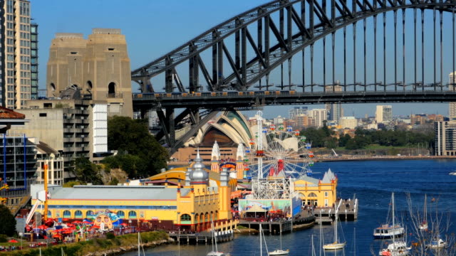 Lavender-Bay,-Sydney-Harbor-Bridge,-Luna-Park,-North-Sydney-and-Sydney-Opera-House-(4K/UHD-to-HD)